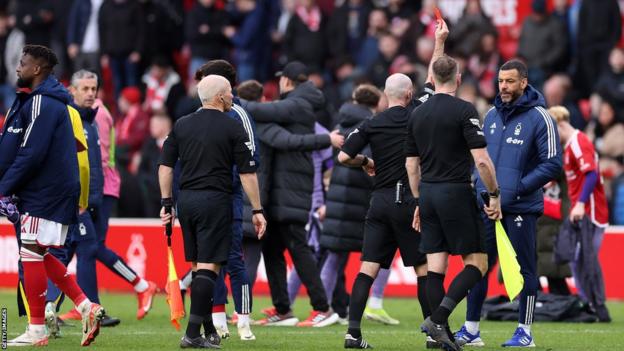 Nottingham Forest first-team coach Steven Reid is sent off by referee Paul Tierney after Premier League game against Liverpool