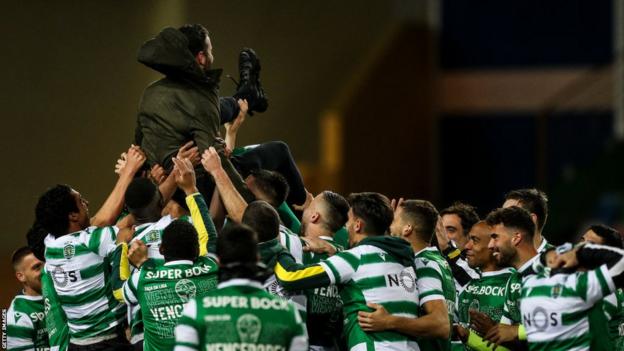 Sporting CP players celebrate with coach Ruben Amorim