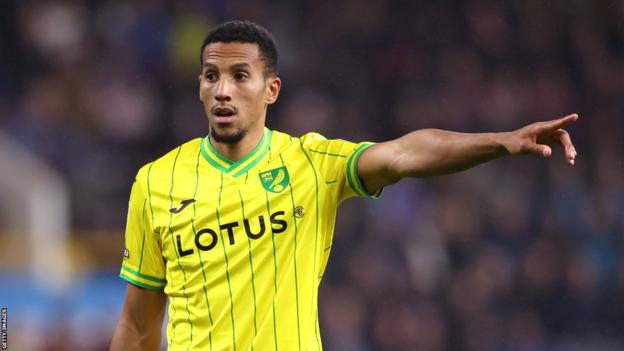 Isaac Hayden holds his arm out to point during a Norwich game