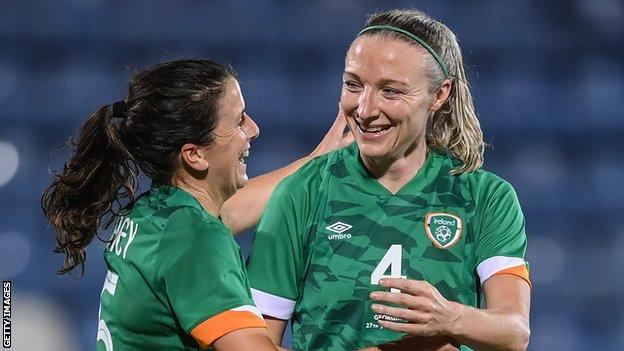 Fahey celebrates with Quinn after scoring her first international goal