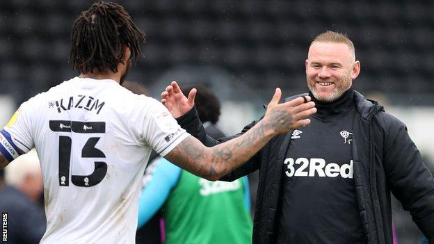 Derby County manager Wayne Rooney (right) and striker Colin Kazim-Richards