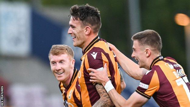 Andy Cook (centre) has now scored three goals in three games for Bradford City this season