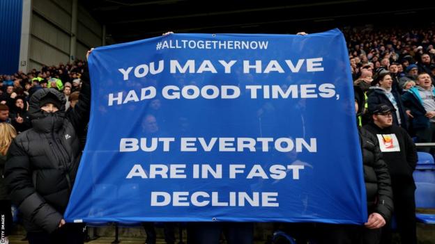 Everton fans hold up a protest banner