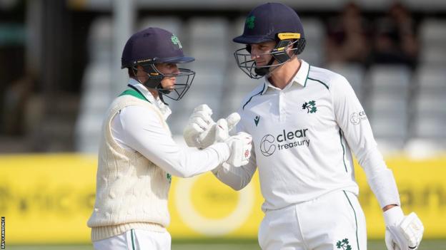 James McCollum and Peter Moor shake hands after Ireland's victory at The County Ground