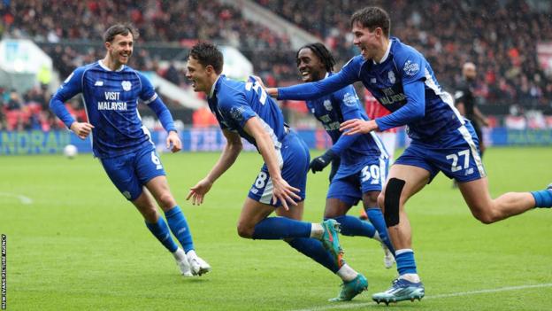 Cardiff players celebrate Perry Ng's goal