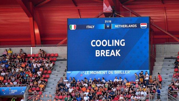 Image of big screen in stadium showing cooling break alert