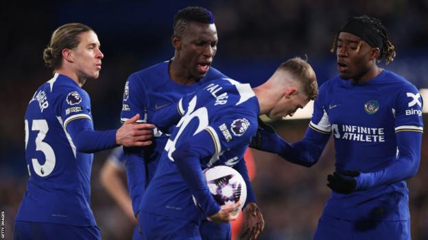 Chelsea players argue over who will take a penalty