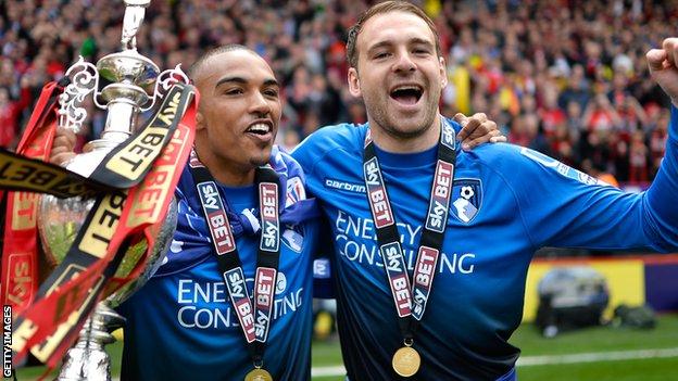 Bournemouth's Junior Stanislas and Brett Pitman with the Championship trophy in 2015