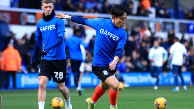 Koji Miyoshi and his fellow Birmingham City players showed their support for manager Tony Mowbray prior to kick off at Portman Road