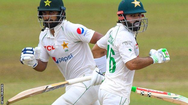 Pakistan batters Abdullah Shafique (left) and Mohammad Rizwan (right) run between the wickets