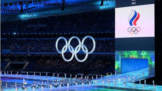 Team ROC carry flags during the Opening Ceremony of the Beijing 2022 Winter Olympics