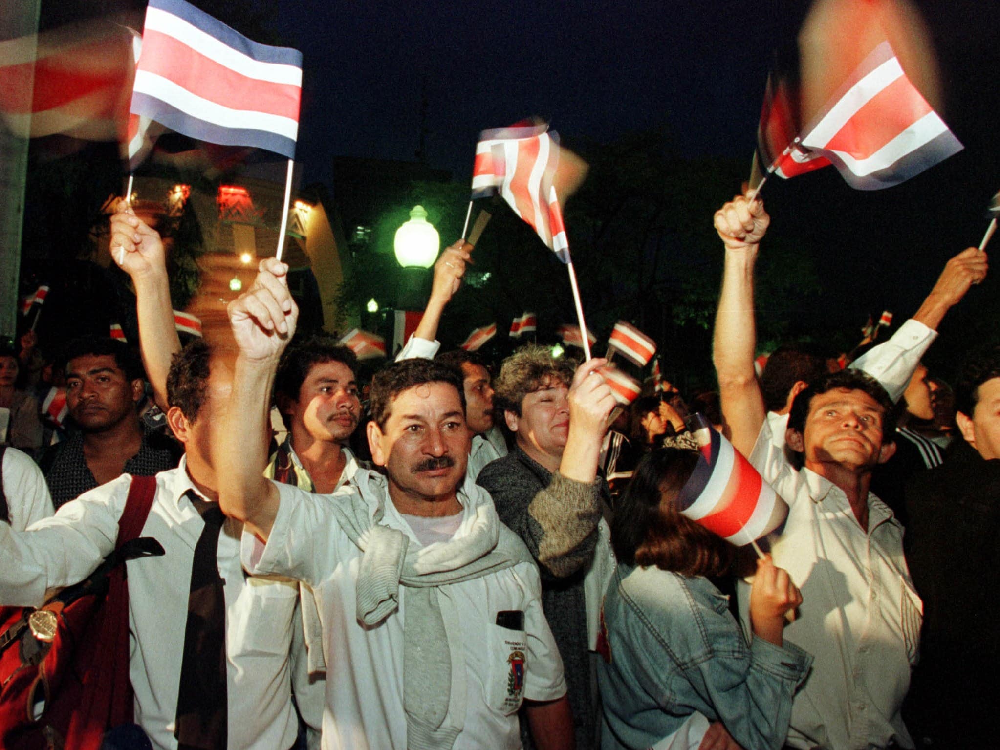 Costa Ricans wave flags during the arrival of the torch of the freedom to commemorate Costa Rica's Independence., REUTERS/Juan Carlos Ulate