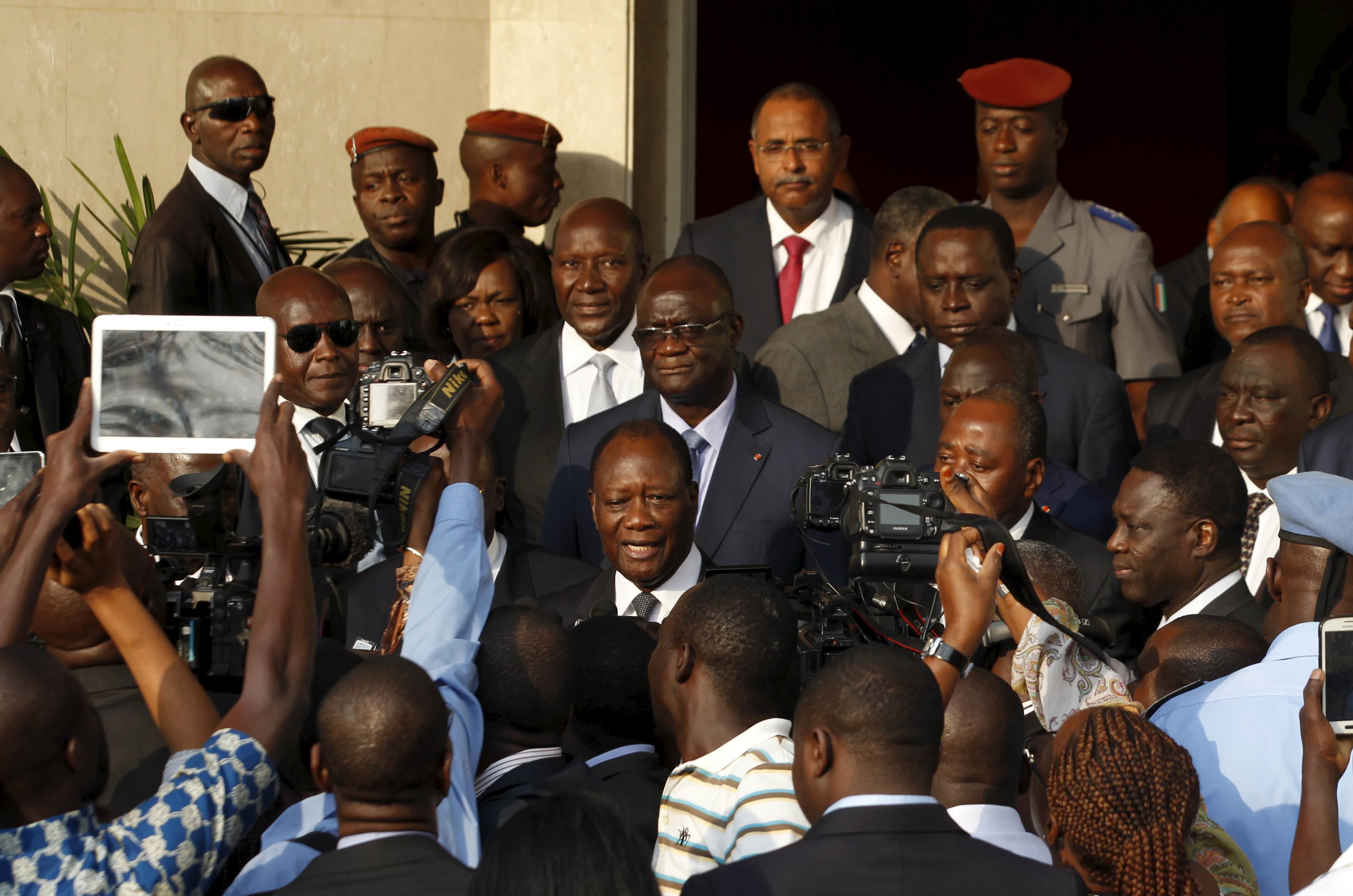 Ivory Coast's President Alassane Ouattara (C) speaks to journalists in Abidjan, Ivory Coast, 5 August 2015, REUTERS/Luc Gnago