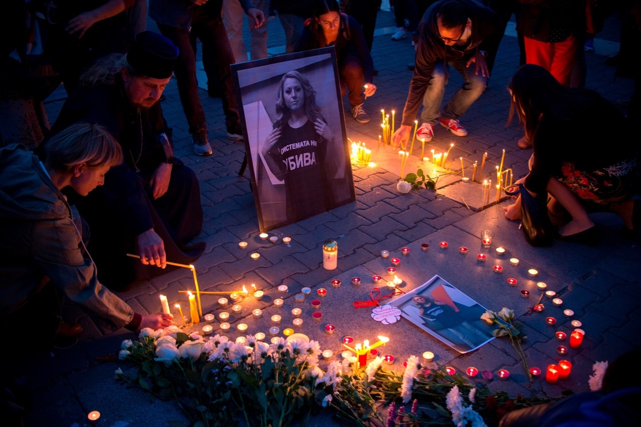 People light candles during a vigil in memory of murdered Bulgarian TV journalist Viktoria Marinova in Sofia, 8 October 2018, NIKOLAY DOYCHINOV/AFP/Getty Images