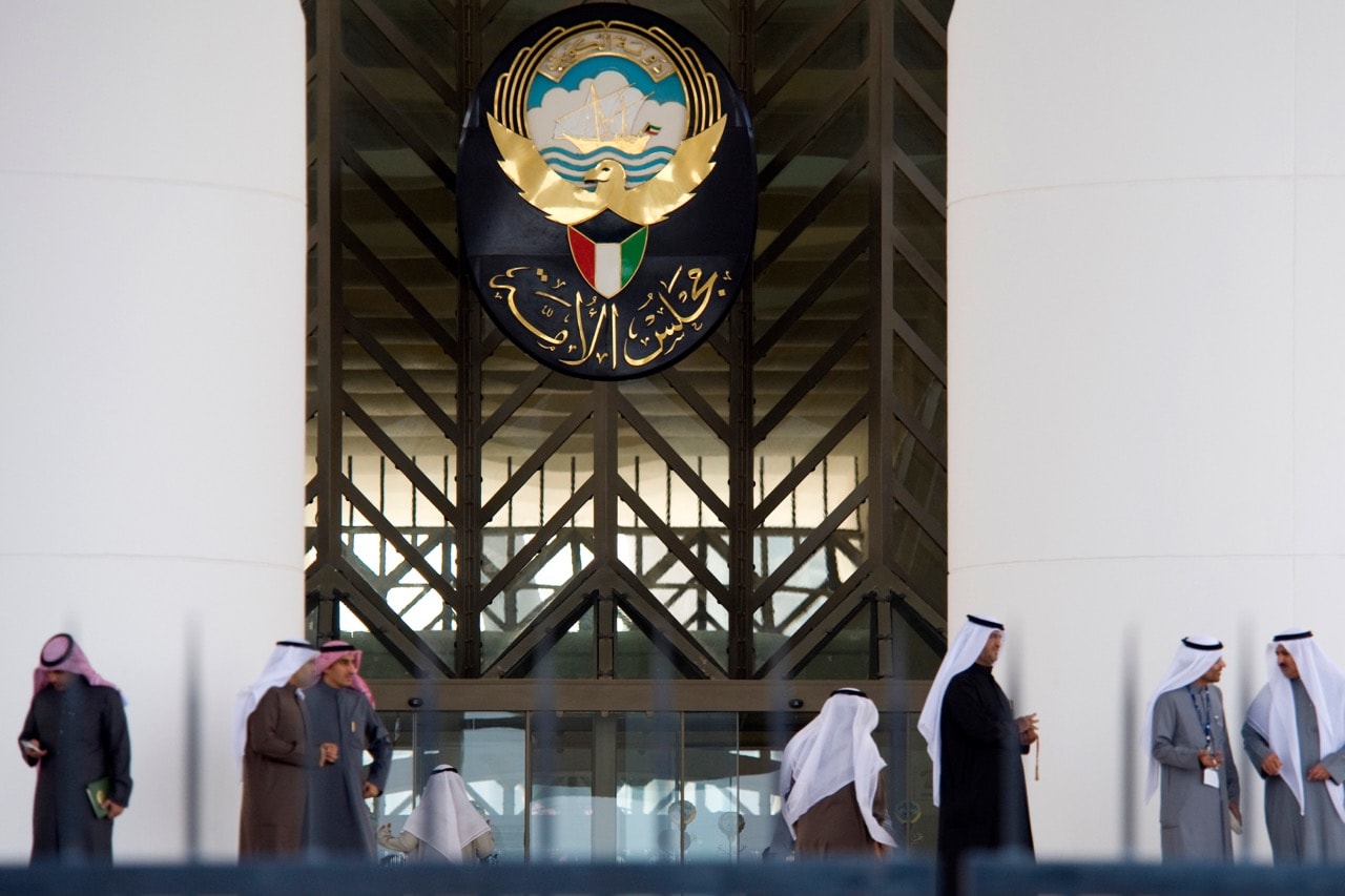 Men stand at the main entrance of the Kuwait Parliament on 10 December 2009, after a parliament session on the issue of "bedoons" was cancelled due to lack of quorum, REUTERS/Stephanie McGehee