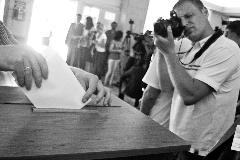 A journalist documents the municipal voting process in Chisinau, Moldova, June 2011., Ramin Mazur/Demotix