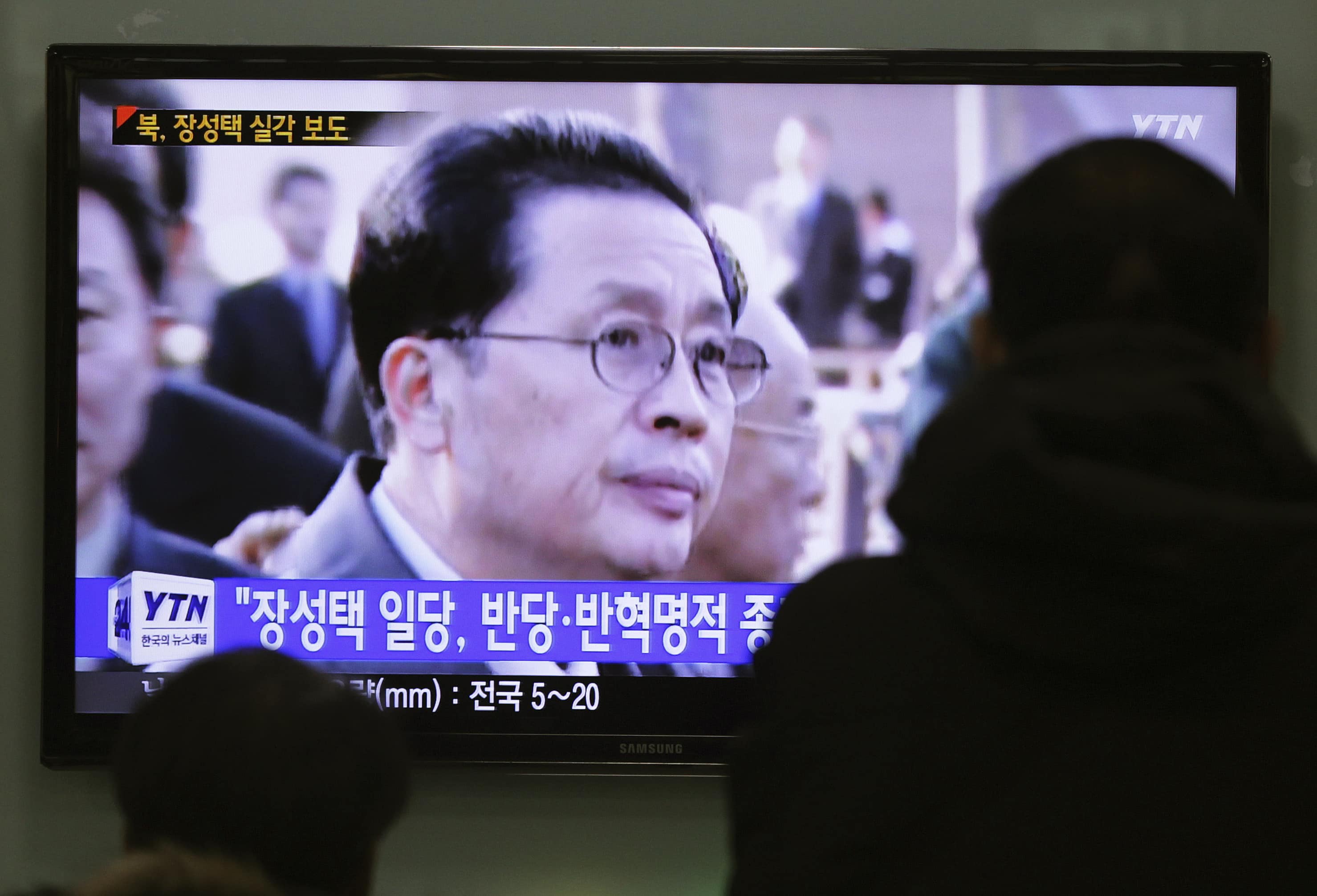 People watch a TV news program showing North Korean leader Kim Jong Un's uncle, Jang Song Thaek, who was executed on 12 December. Hundreds of online articles mentioning him have been deleted, AP Photo/Ahn Young-joon