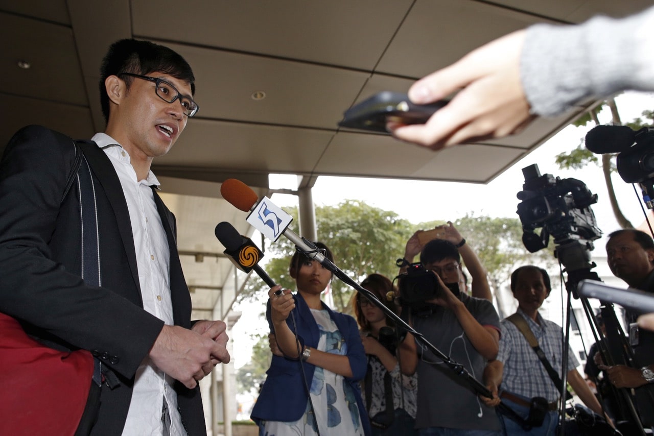 Blogger Roy Ngerng speaks to the media after attending a damages hearing in a defamation case by Singapore's Prime Minister Lee Hsien Loong at the Supreme Court in Singapore, 1 July 2015, REUTERS/Edgar Su