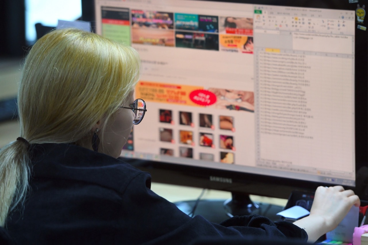 An employee of the Santa Cruise 'digital laundry' company monitors a computer screen to find 'revenge porn' in Seoul, South Korea, 24 July 2017, JUNG YEON-JE/AFP/Getty Images