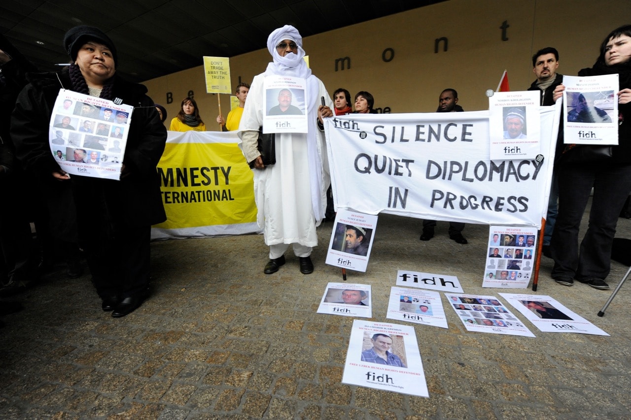 Uzbek human rights defender Mutabar Tadjibaeva (L), who was detained and tortured in Uzbek jails before being freed in 2008, takes part in an Amnesty protest in support of Uzbek detained human rights defenders in front of the European Commission in Brussels, Belgium, 24 January 2011, JOHN THYS/AFP/Getty Images