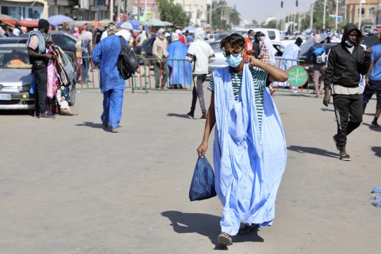 People wearing face masks are seen at a street market during the Covid-19 pandemic, Nouakchott, Mauritania, 30 December 2020, Cheyakhe Ali/Anadolu Agency via Getty Images