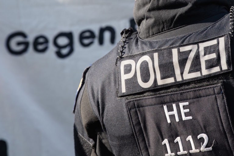 After the disbandment of the Frankfurt special task force because of right-wing extremist chat groups, left-wing alliances demonstrate as an officer looks on, Frankfurt, Hessen Germany, 11 June 2021, Boris Roessler/picture alliance via Getty Images