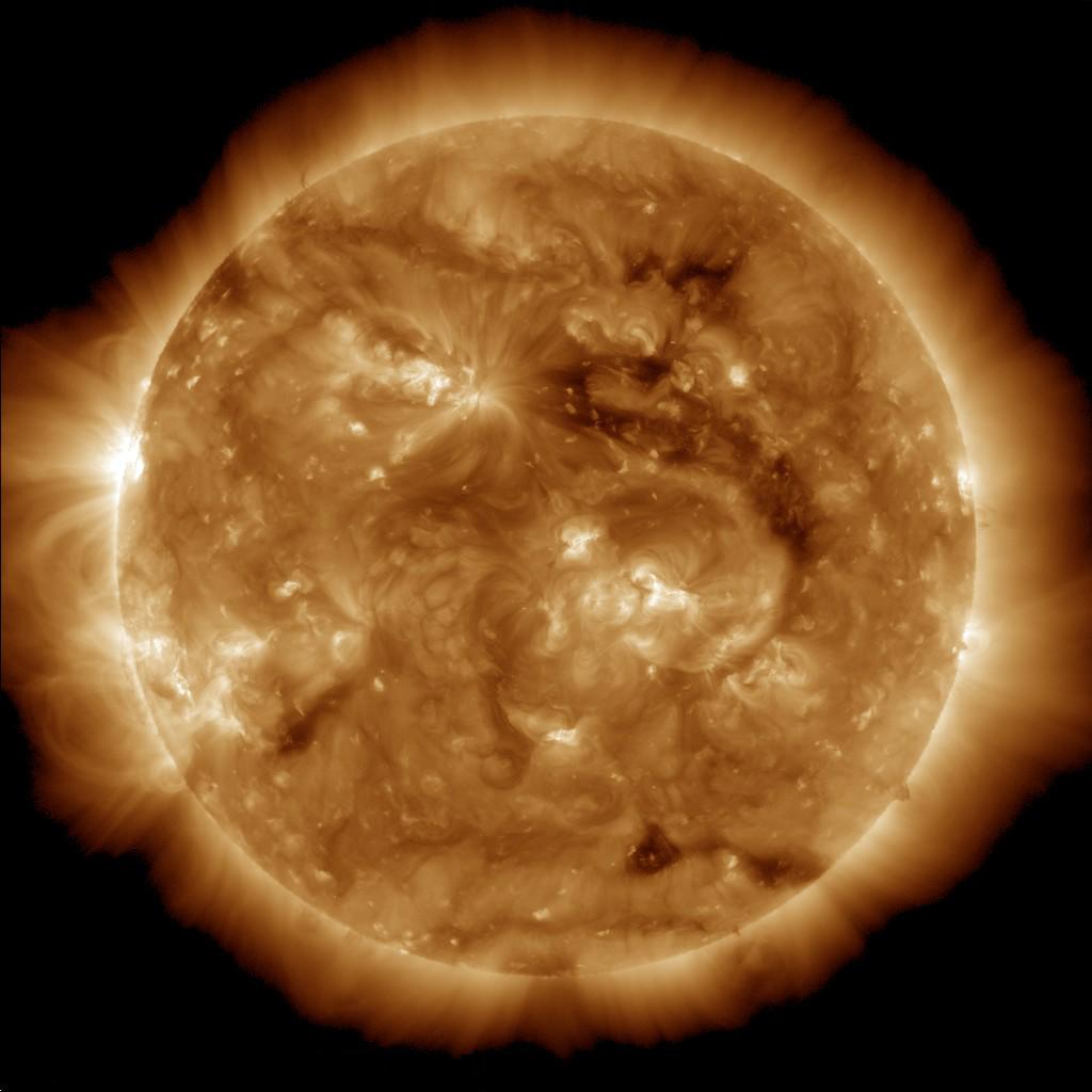 The dark region seen on the face of the sun at the end of March 2013 is a coronal hole just above and to the right of the middle of the picture, which is a source of fast solar wind leaving the sun in this image from NASA Solar Dynamic Observatory.