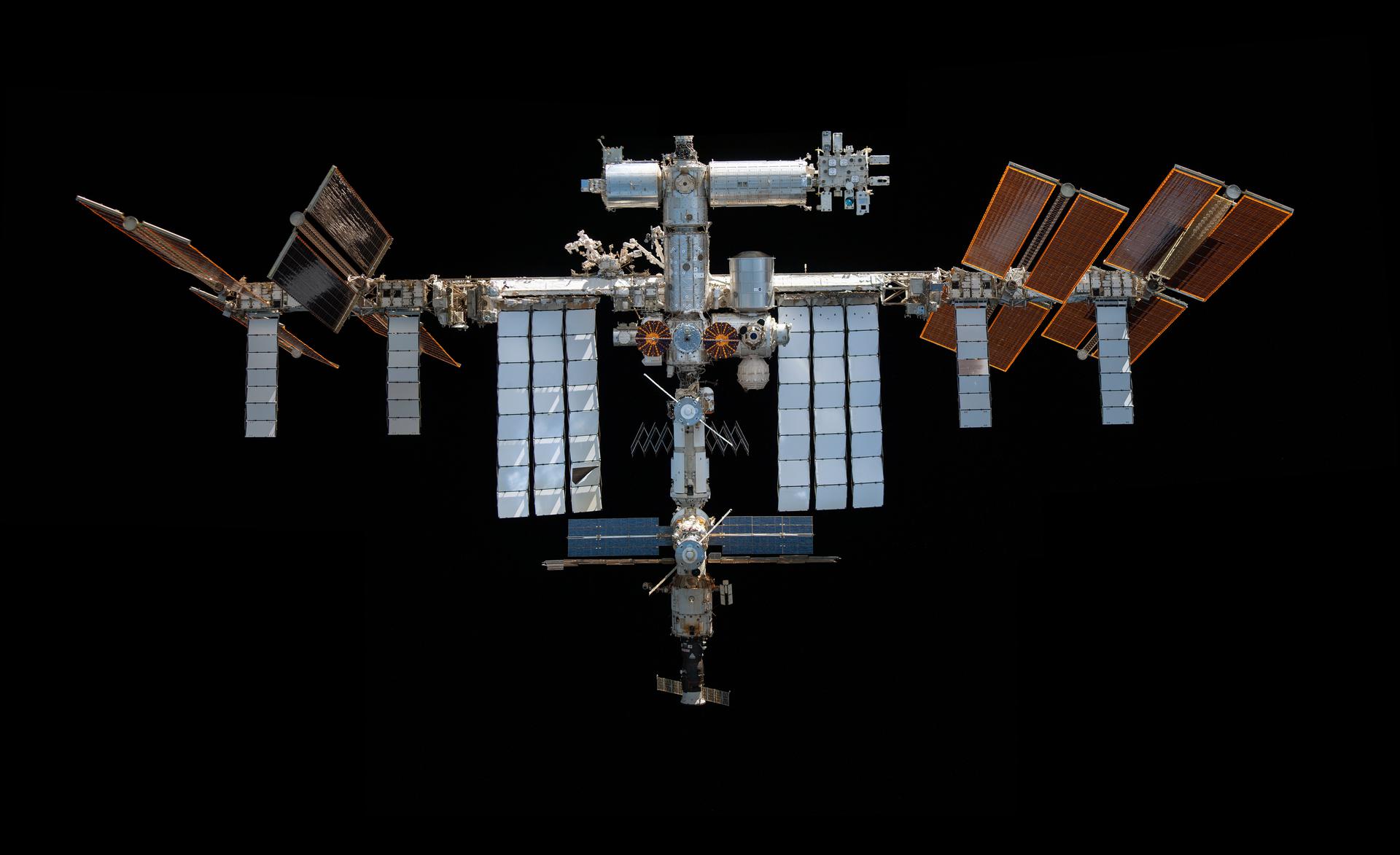 This mosaic depicts the International Space Station pictured from the SpaceX Crew Dragon Endeavour during a fly around of the orbiting lab.