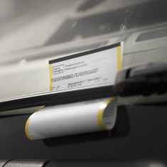 A parking ticket on a car's windscreen. 