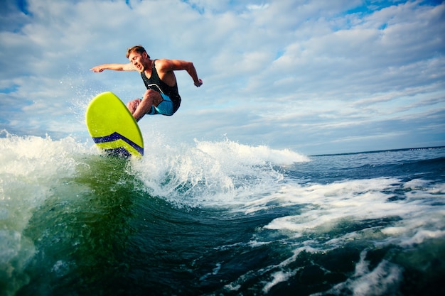 Courageous surfer riding a wave