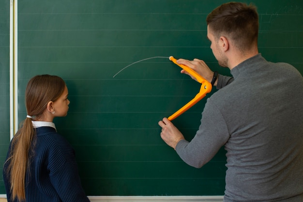 Side view girl learning math at school