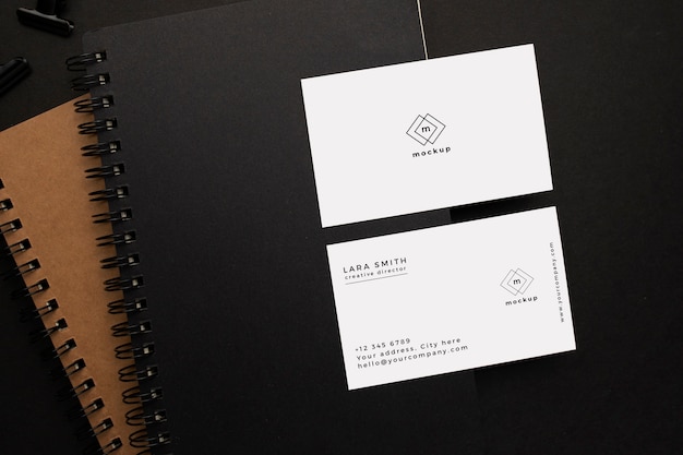 Free PSD notebooks and visiting card mockup with black element on black background