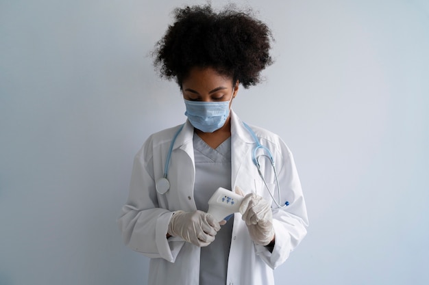 Black female doctor with mask front view