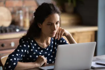 photo of woman using computer