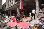 Palestinian children in the rubble of a house destroyed by Israeli shelling, in Rafah, southern Gaza Strip, on April 27, 2024.