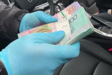 Деньги, которые жителям Дзержинска дали в качестве взятки.Скриншот: видео МВД