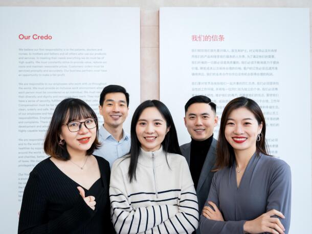 Group of Johnson & Johnson employees in front of Our Credo