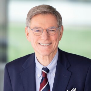 Headshot of William N. Hait, M.D., Ph.D. in a blue suit and red, white & blue striped tie 