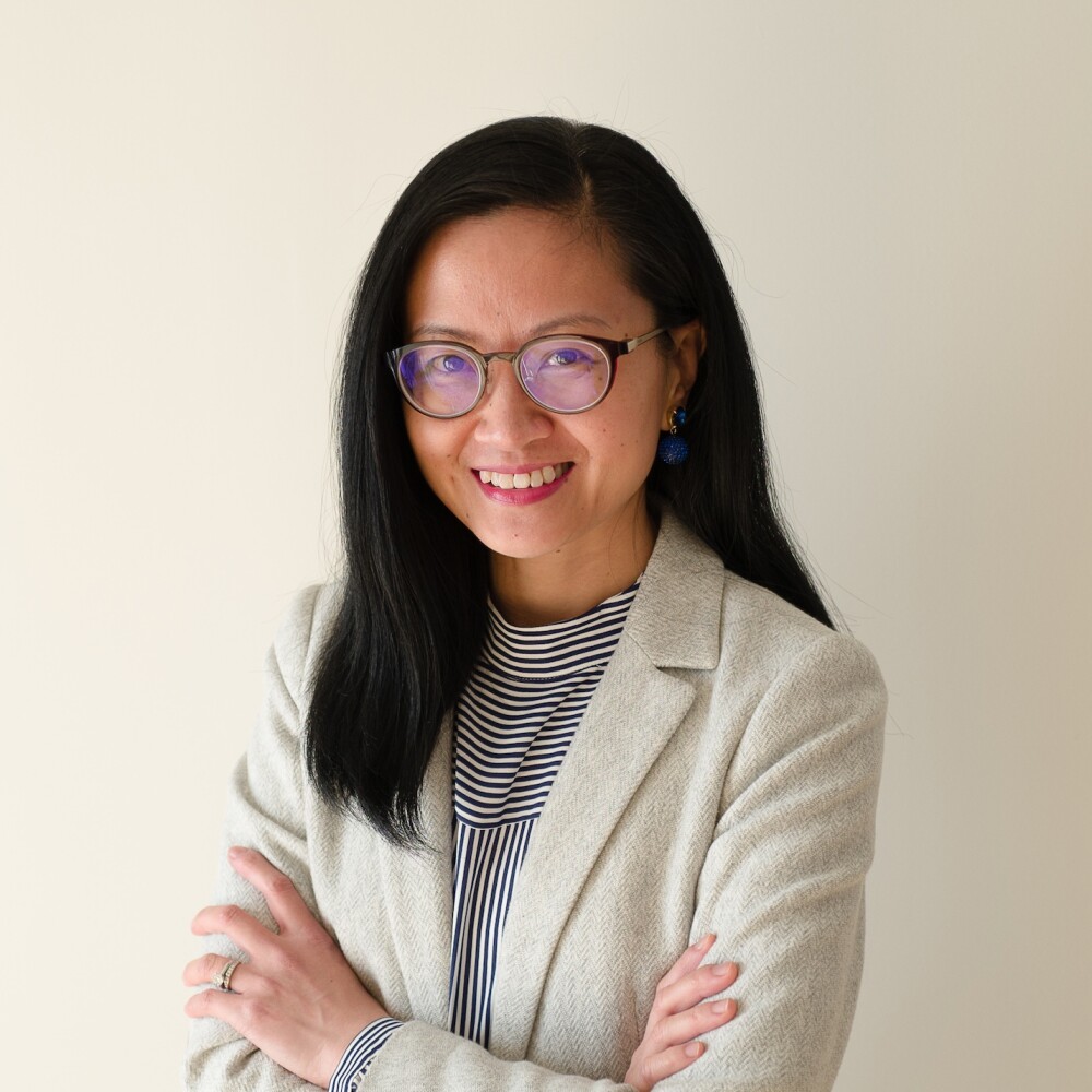 Headshot of Dr. Daphne Chan with her arms crossed 