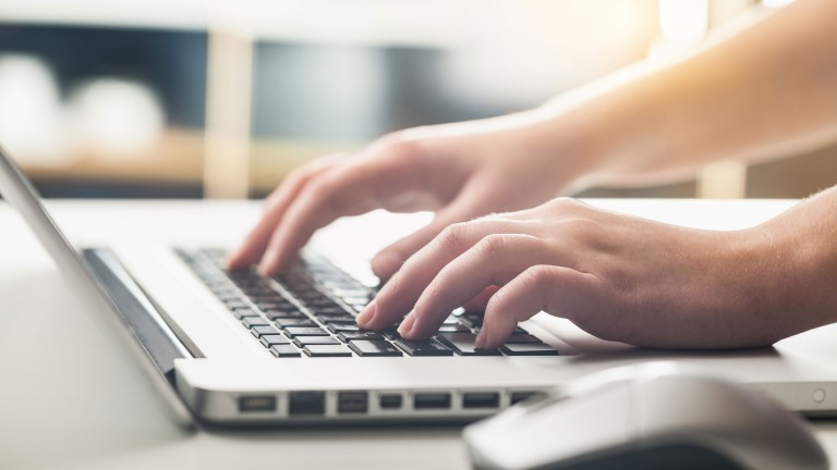 business-woman-hands-using-laptop