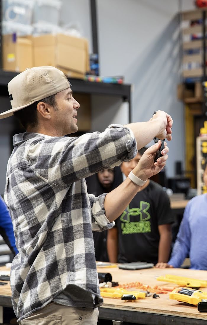 Mark Rober sharing how to build a nerfgun to middle school students