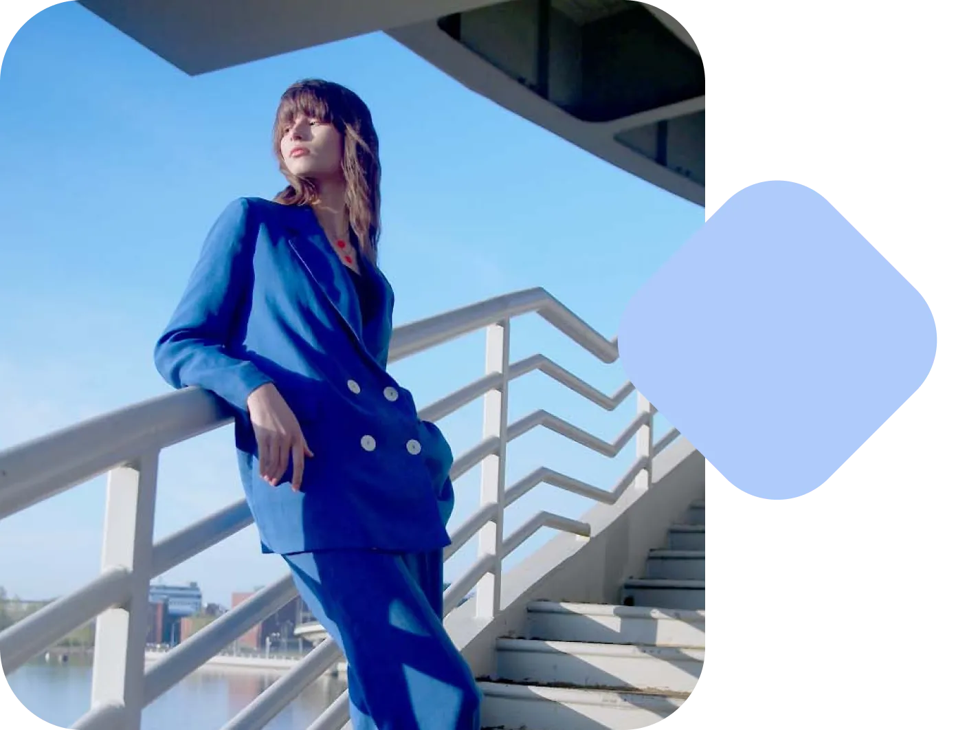 An image of a Lens shopping use case featuring a woman with a blue blazer with an overlapping blue shape.