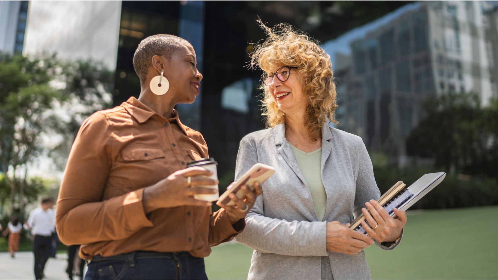 Businessperson talking while walking outdoors