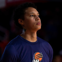 Phoenix Mercury center Brittney Griner stands at attention during the national anthem before a WNBA basketball game against the Washington Mystics, Sunday, July 23, 2023, in Washington. 