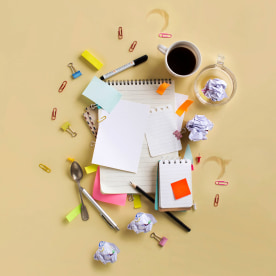 Flat lay view of busy office worker table top objects still life.