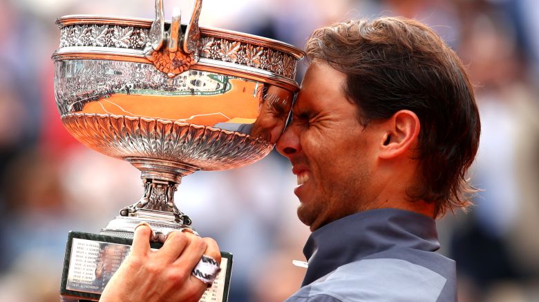 Rafael Nadal lifts the French Open trophy for the 12th time after his four-set victory over Dominic Thiem in Paris.