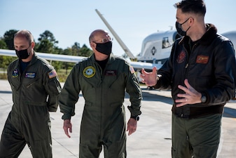 NAVAL AIR STATION PATUXENT RIVER, Md. (Nov. 3, 2020) Chief of Naval Operations (CNO) Adm. Mike Gilday is briefed on the MQ-4C Triton Unmanned Air System during a tour of Naval Air Station Patuxent River. (U.S. Navy photo by Mass Communication Specialist 1st Class Raymond D. Diaz III/Released)
