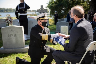 ANNAPOLIS, Md. (Oct. 5, 2020) Chief of Naval Operations Adm. Mike Gilday (CNO) presents an American flag to the son of the late Adm. Carlisle A. H. Trost during a funeral in his honor. Trost, a native of Illinois, served as the 23rd CNO from June 30, 1986, until June 29, 1990. (U.S. Navy photo by Mass Communication Specialist 1st Class Raymond D. Diaz III/Released)