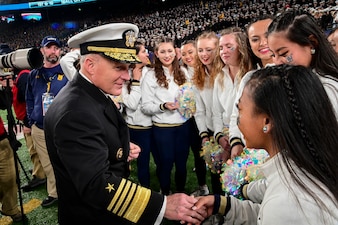 EAST RUTHERFORD, N.J. (Dec. 11, 2021) Chief of Naval Operations (CNO) Adm. Mike Gilday, left, meets with U.S. Naval Academy Midshipmen during the 122nd Army-Navy Football Game. (U.S. Navy photo by Mass Communication Specialist 1st Class Sean Castellano/Released)