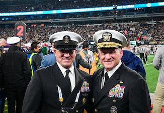 EAST RUTHERFORD, N.J. (Dec. 11, 2021) Chief of Naval Operations (CNO) Adm. Mike Gilday, right, poses for a photo with Master Chief Petty Officer of the Navy Russell Smith during the 122nd Army-Navy Football Game. (U.S. Navy photo by Mass Communication Specialist 1st Class Sean Castellano/Released)